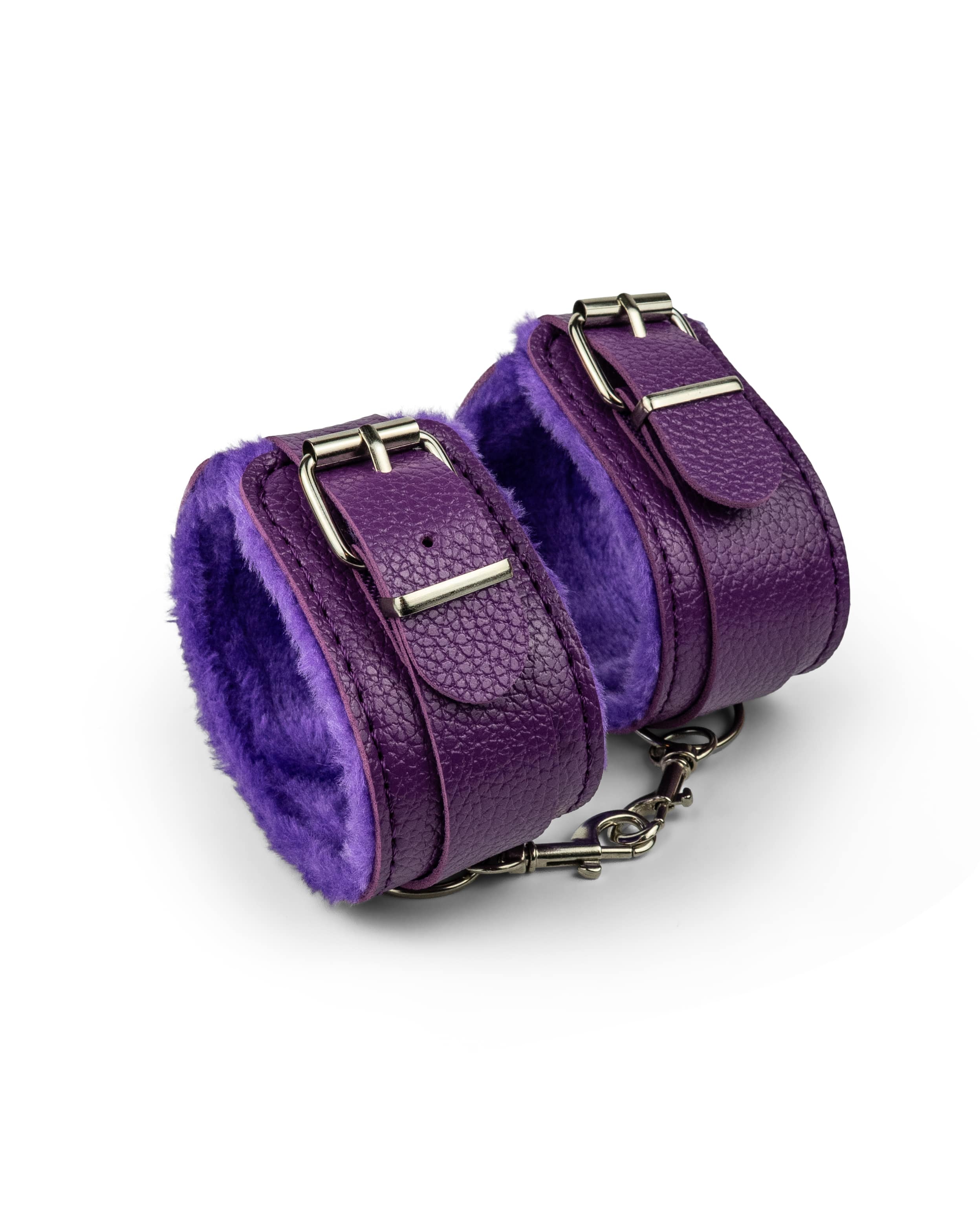 Cosmic purple BDSM ankle cuffs designed with fur-lined padding and adjustable fit for beginner restraint play