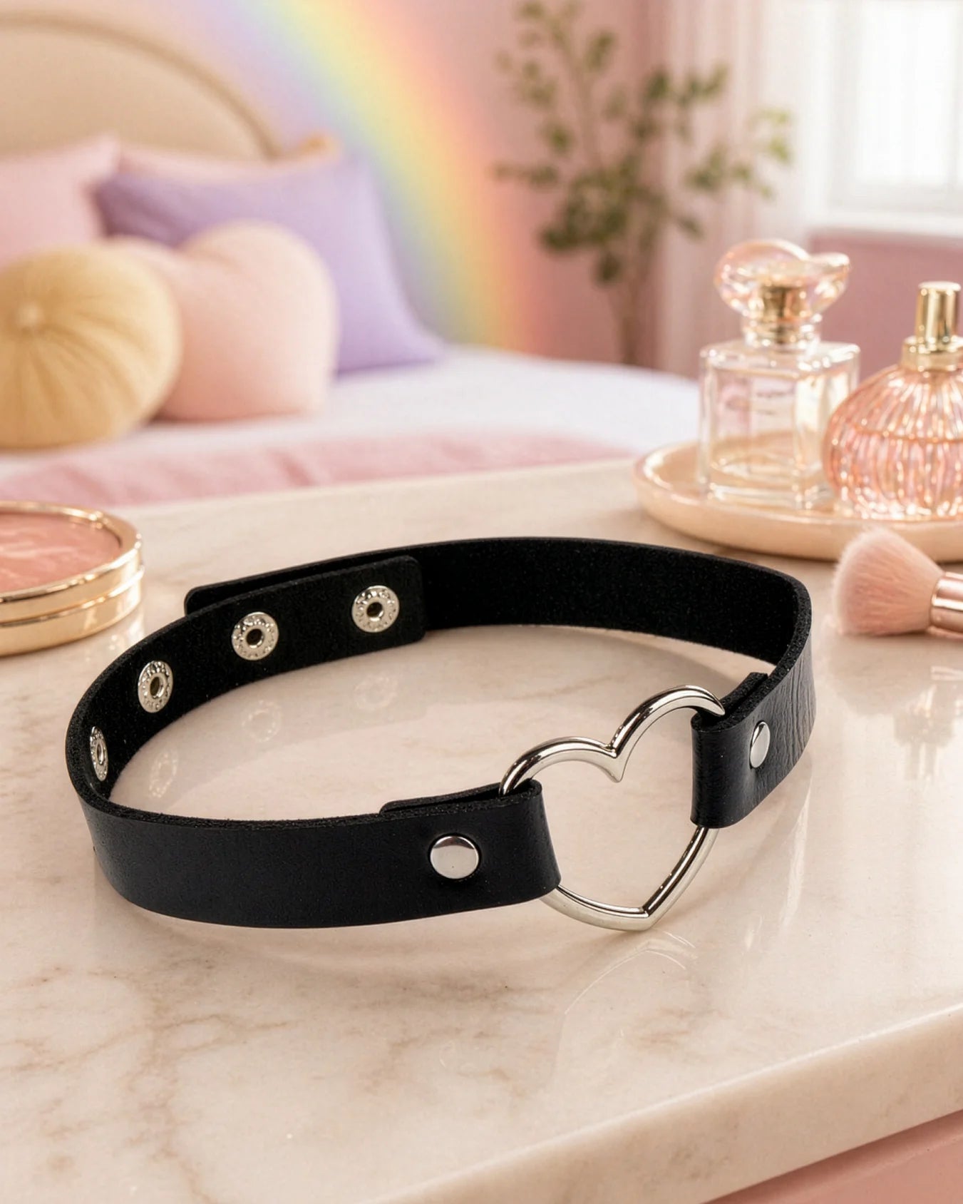 Black BDSM heart choker collar displayed on surface, adjustable faux leather collar with strong hardware and heart ring