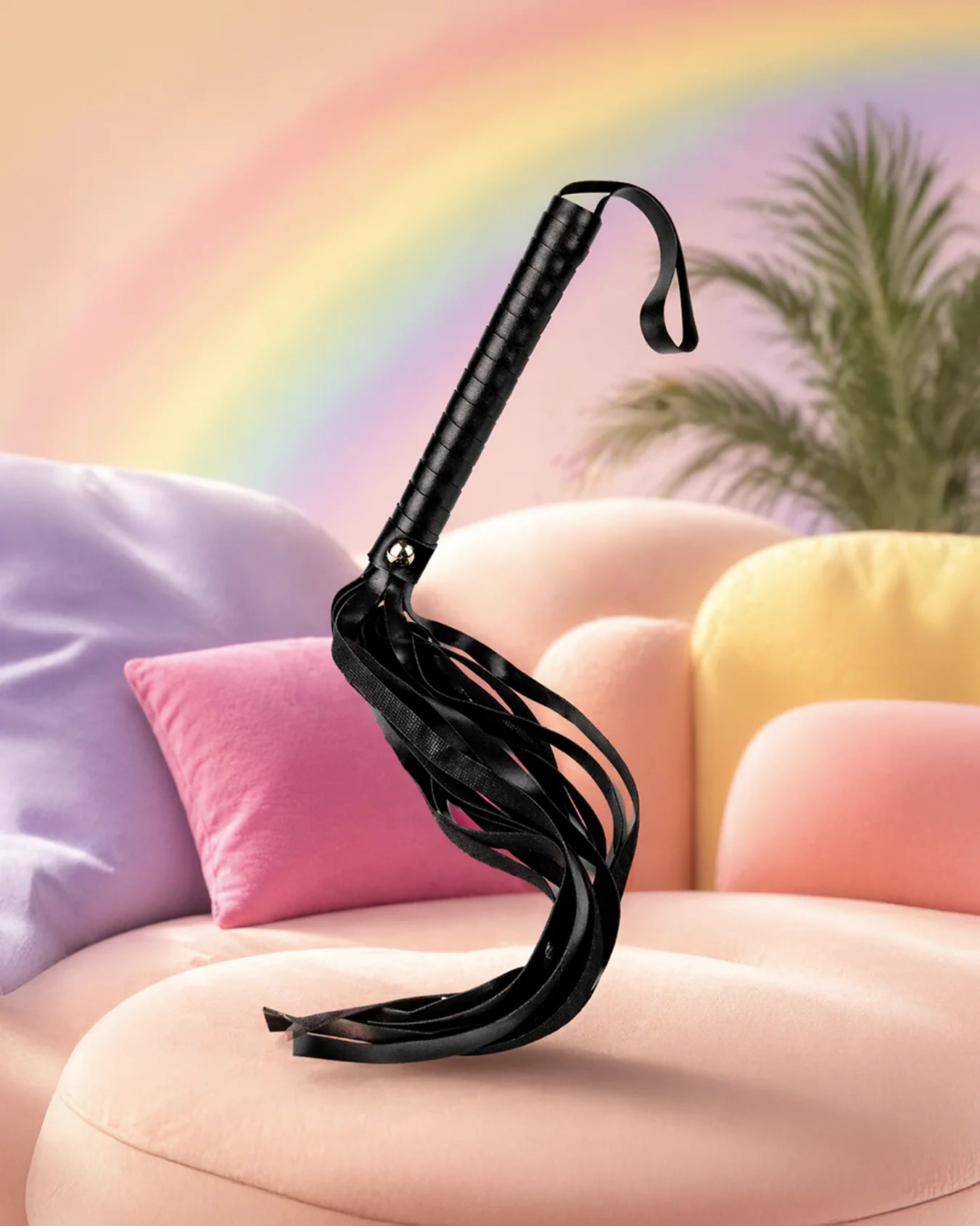 Black faux leather BDSM flogger with soft responsive tails for controlled spanking and impact play