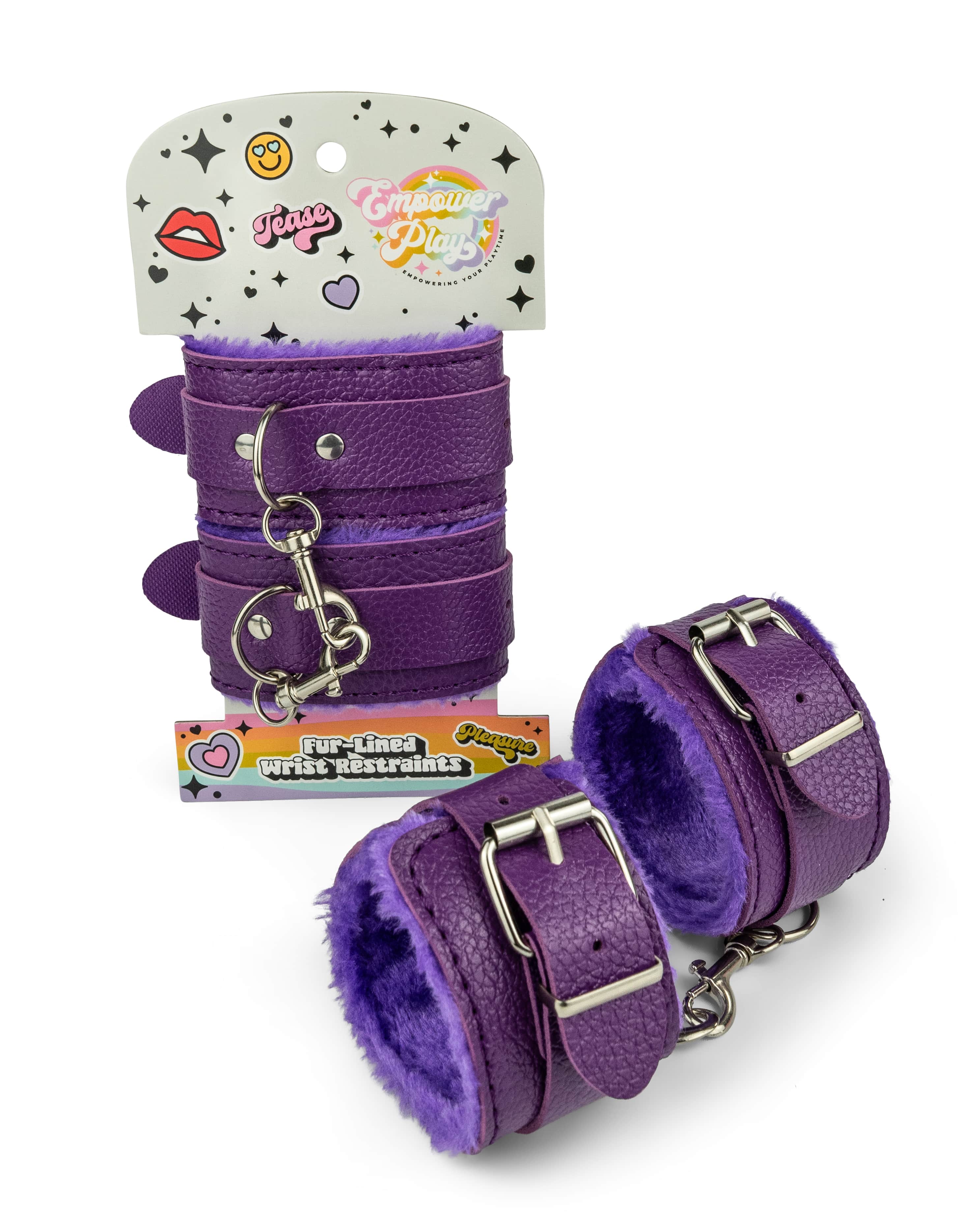 Cosmic purple fur-lined wrist restraints shown in Empower Play retail packaging with padded cuffs displayed outside the package for beginner bondage