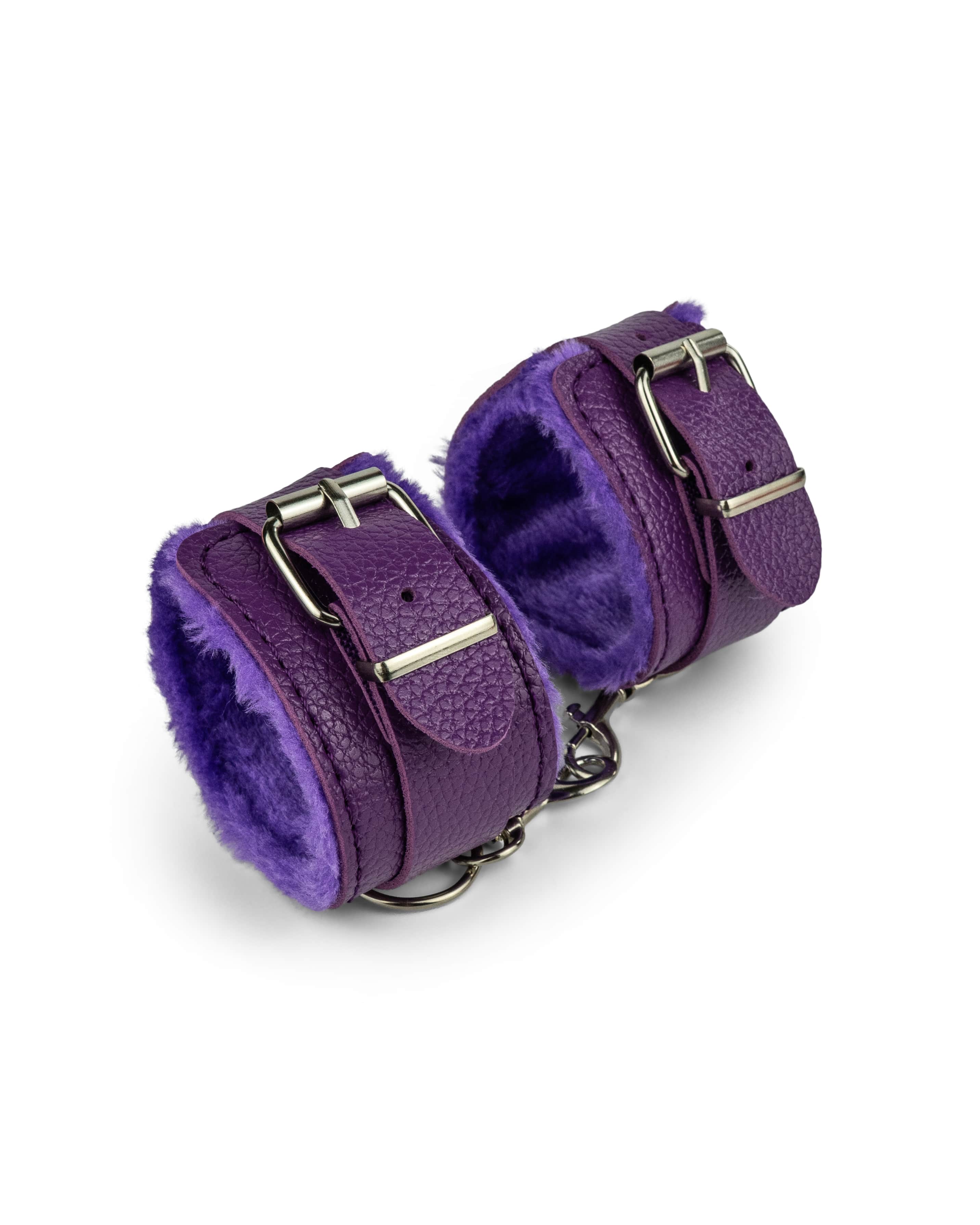 Cosmic purple fur-lined wrist restraints with soft plush lining and metal chain for beginner bondage, roleplay, and light restraint