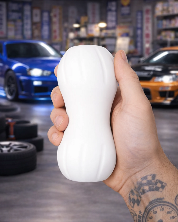 Drift King male stroker held in hand showing size scale ergonomic grip and smooth exterior texture
