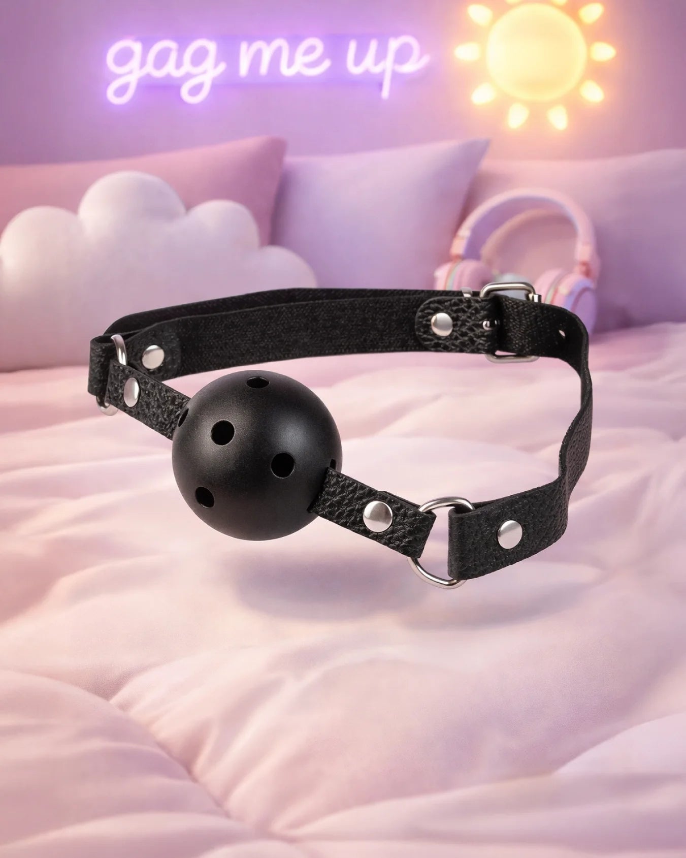 Black breathable ball gag by Empower Play™ with airflow holes and adjustable strap, sleek beginner-friendly mouth gag