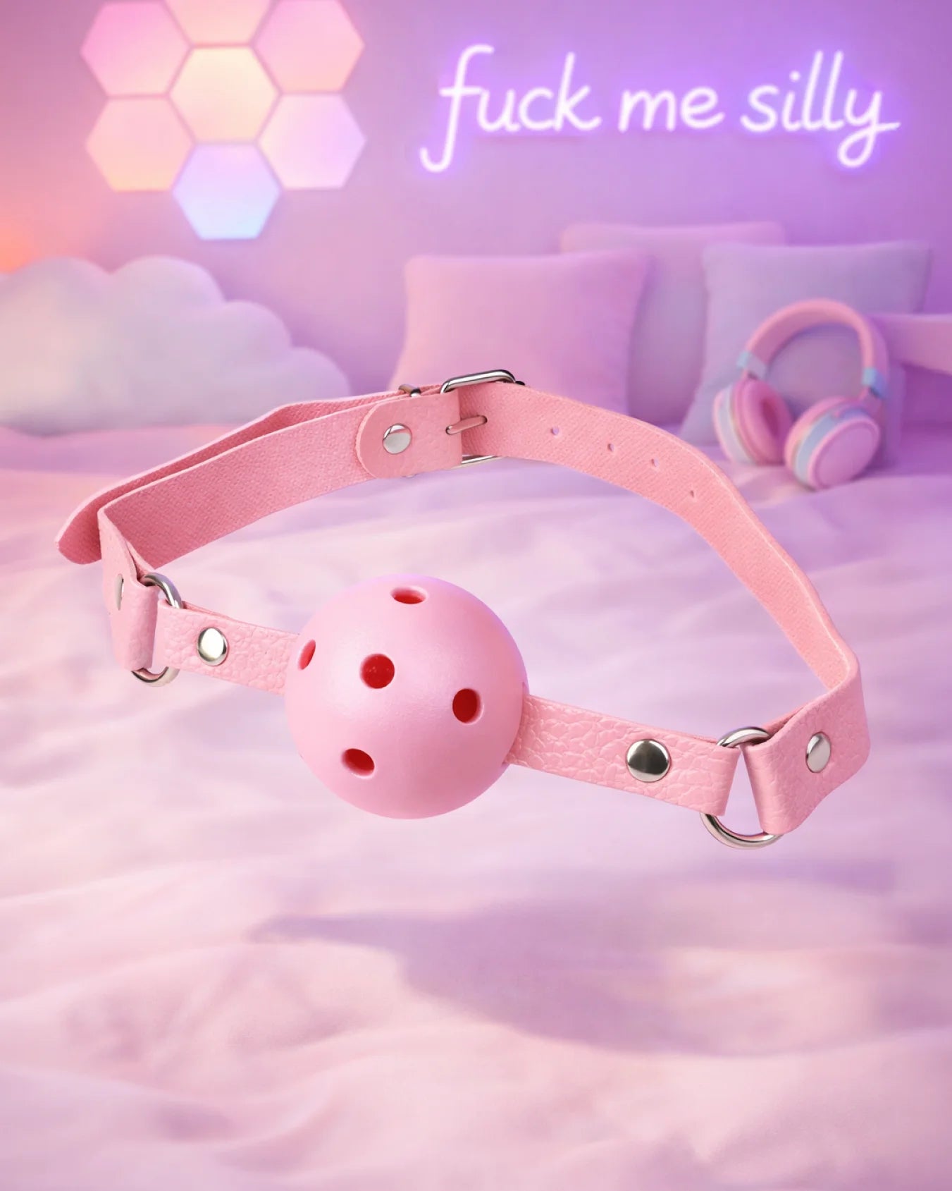 Pink breathable ball gag by Empower Play™ with airflow holes and adjustable strap, beginner-friendly BDSM mouth gag design