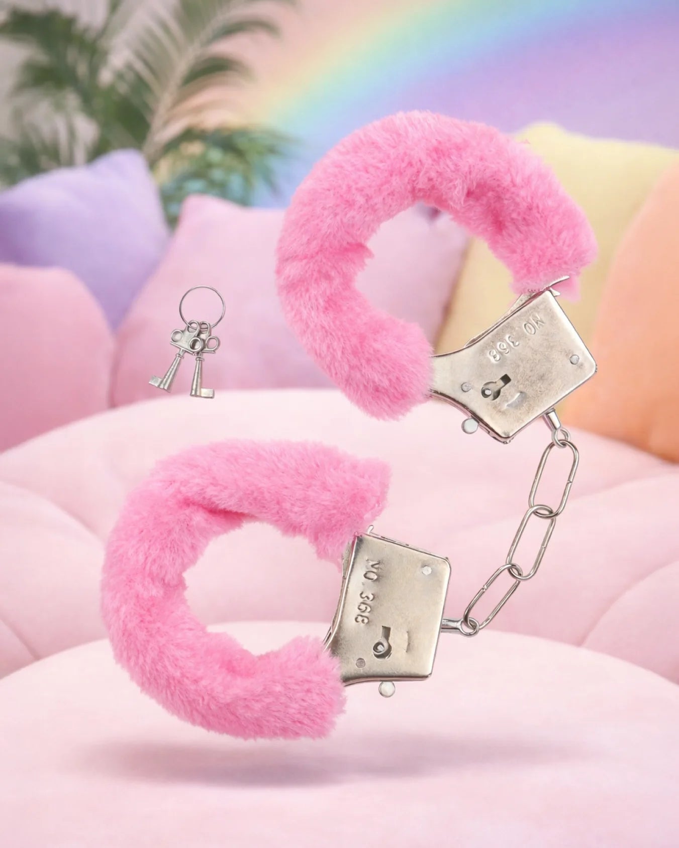 Pink furry bondage handcuffs by Empower Play™ with soft faux fur lining and adjustable fit for beginner BDSM restraint