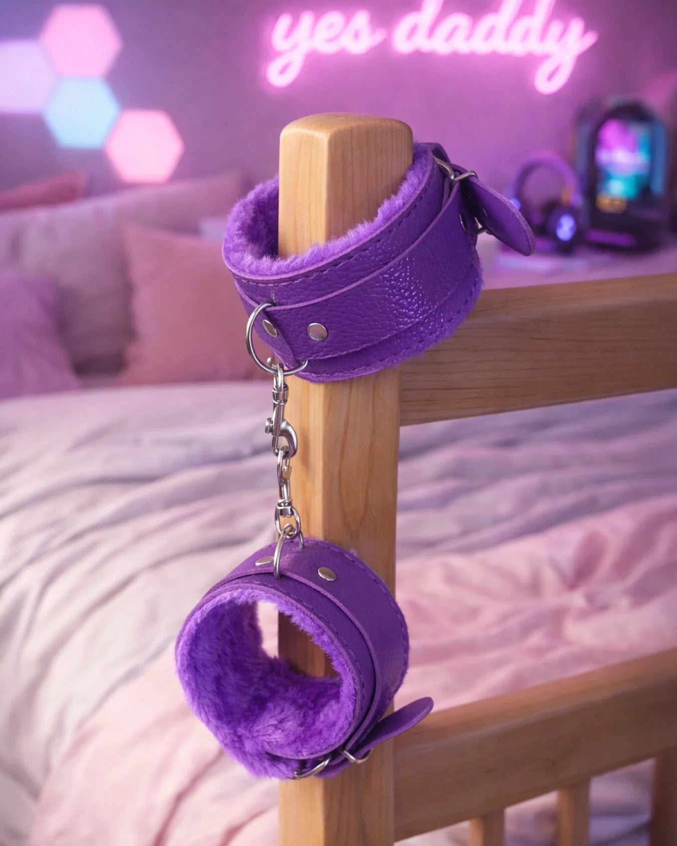 Purple fur-lined ankle restraints attached to bedpost with chain, designed for gentle and controlled restraint