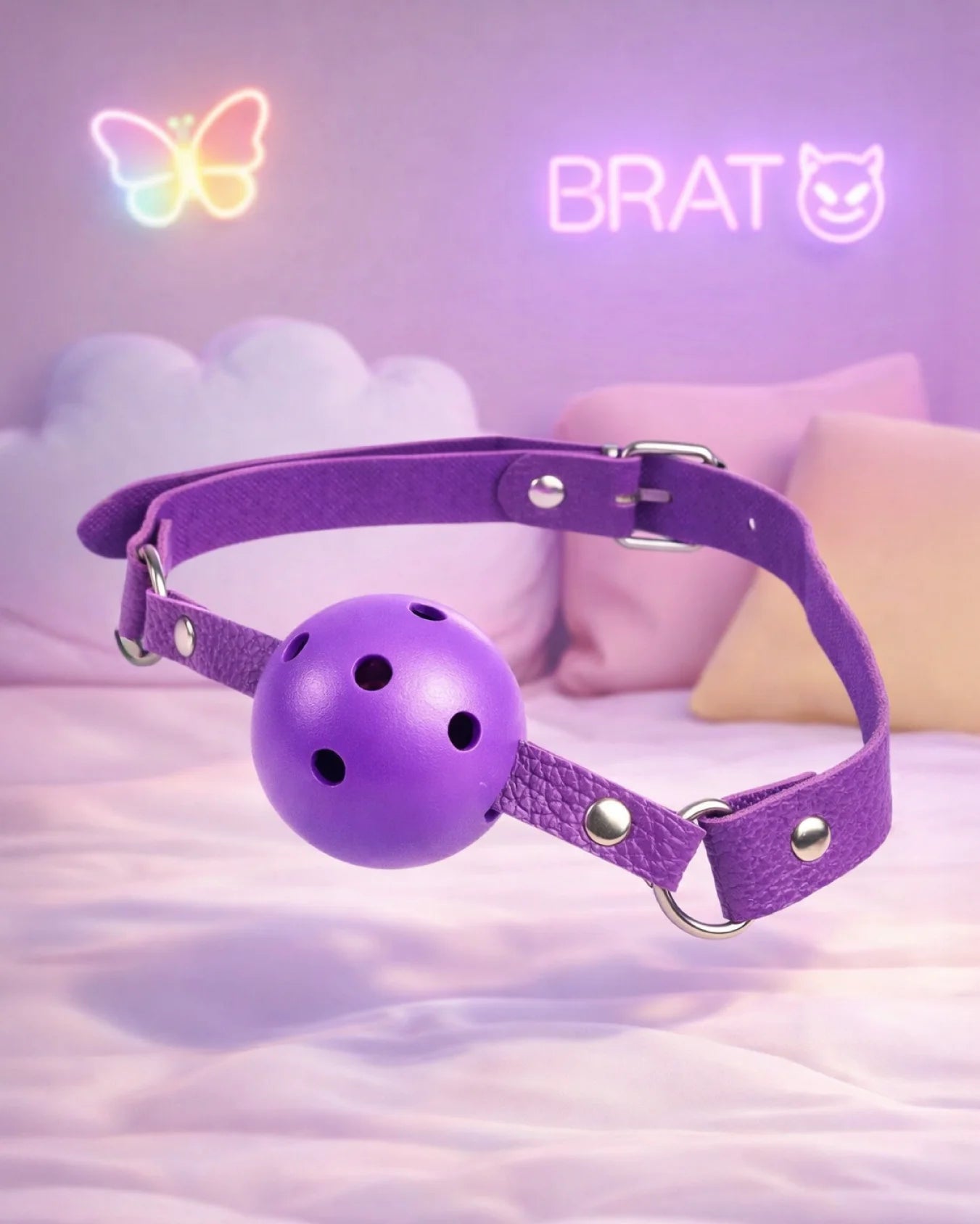 Purple breathable ball gag by Empower Play™ with airflow holes and adjustable strap for playful BDSM mouth restraint