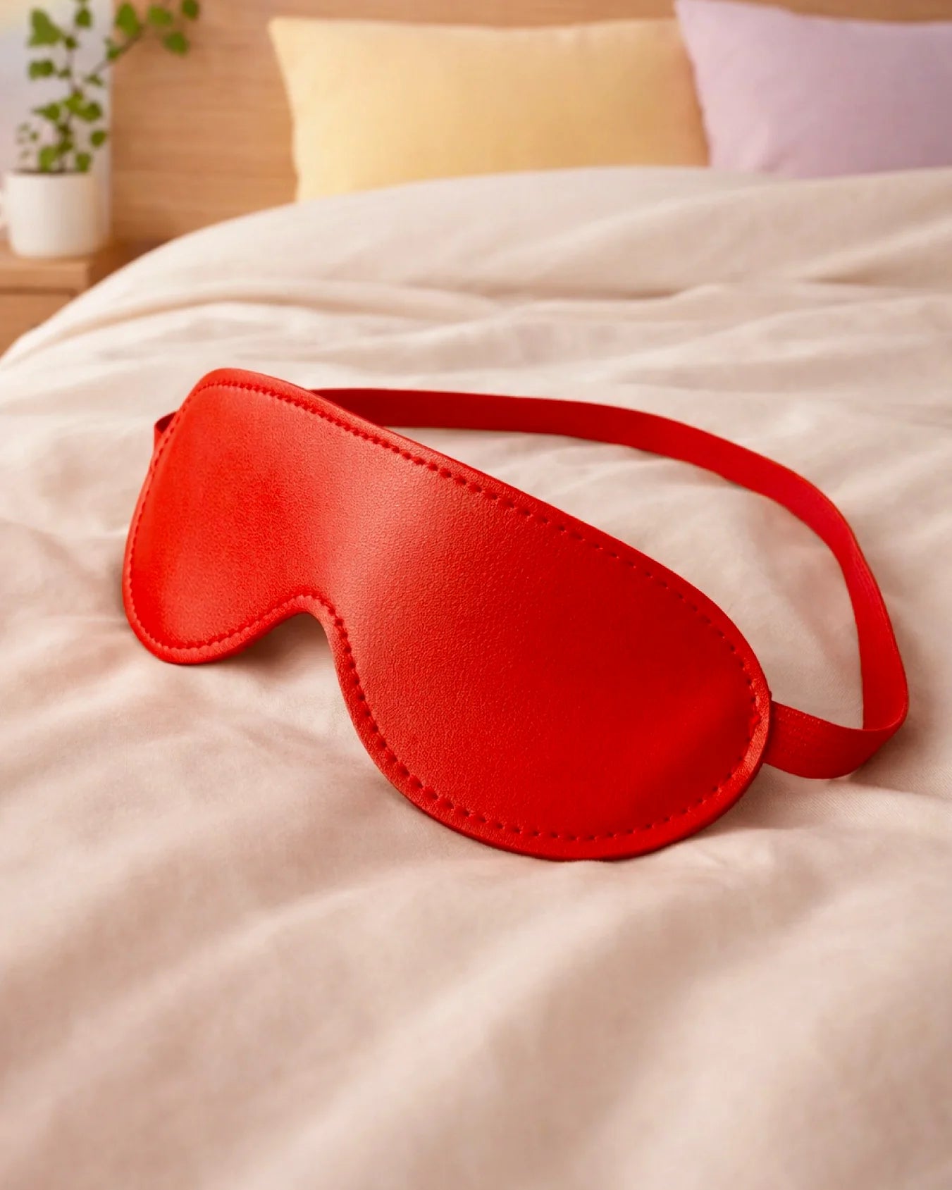 Empower Play™ red faux leather beginner BDSM blindfold flat lay — padded design for sensory play