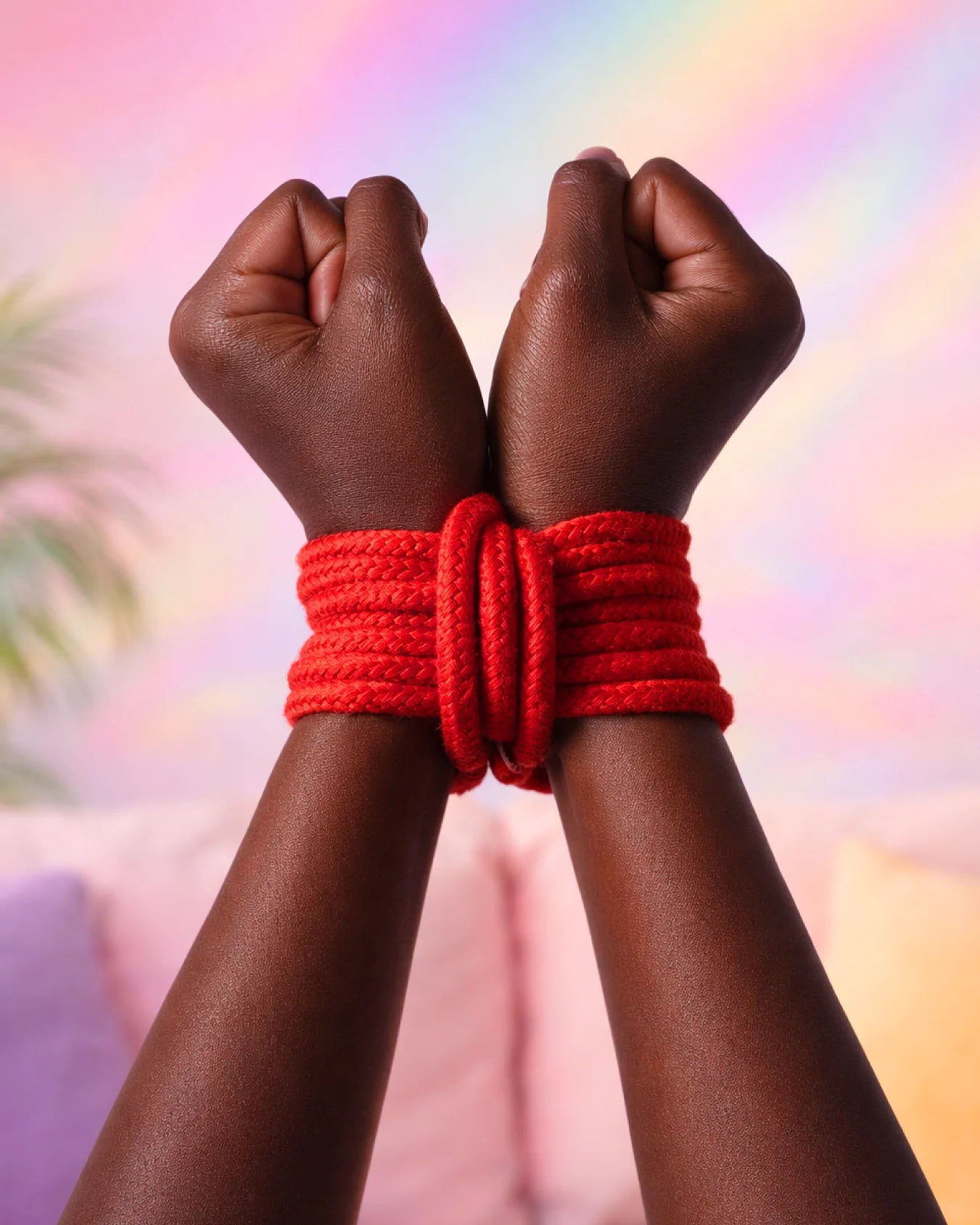 Red cotton bondage rope tied around wrists for BDSM restraint, strong and soft rope for secure bondage tying