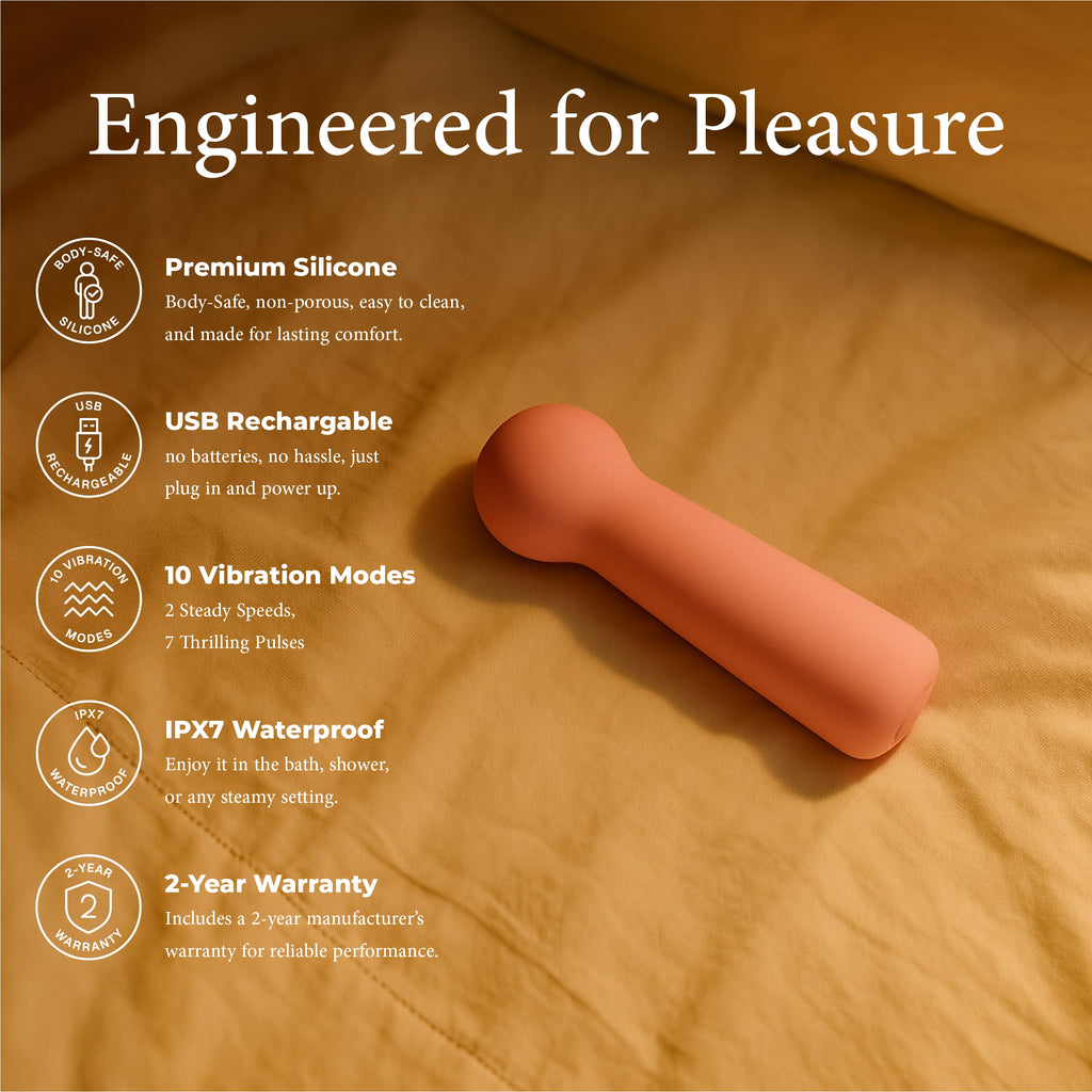 Joy Penny mini wand clitoral massager in pastel pink showing body safe silicone USB recharge waterproof and vibration modes