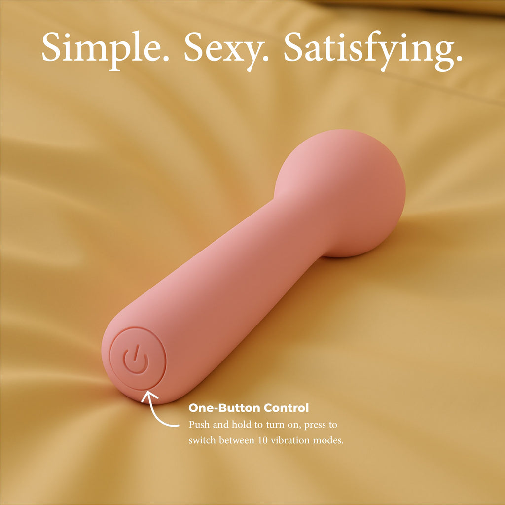 Joy Penny mini wand vibrator in pastel pink with one button control for switching between vibration modes