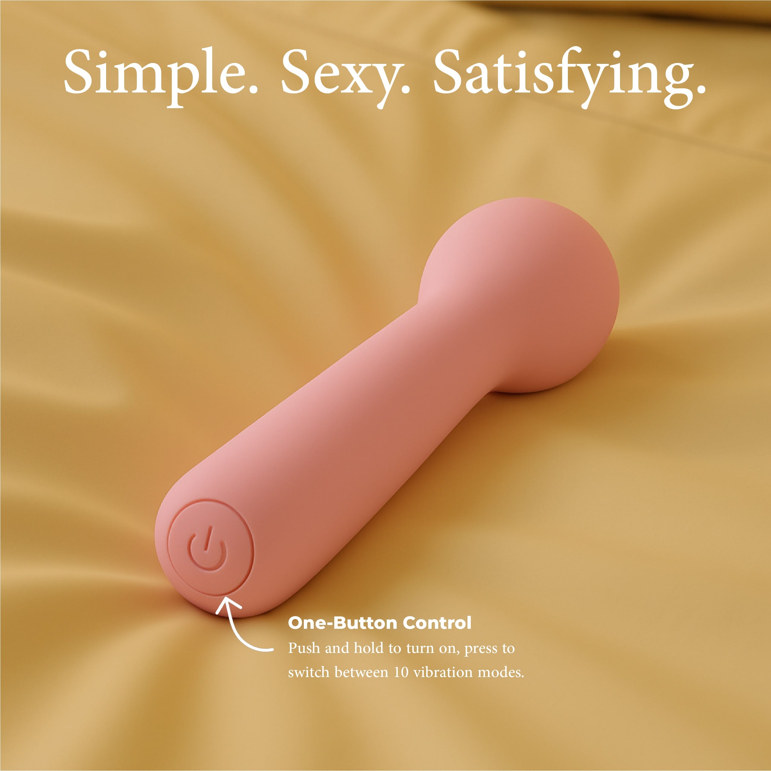 Joy Penny mini wand vibrator in pastel pink with one button control for switching between vibration modes