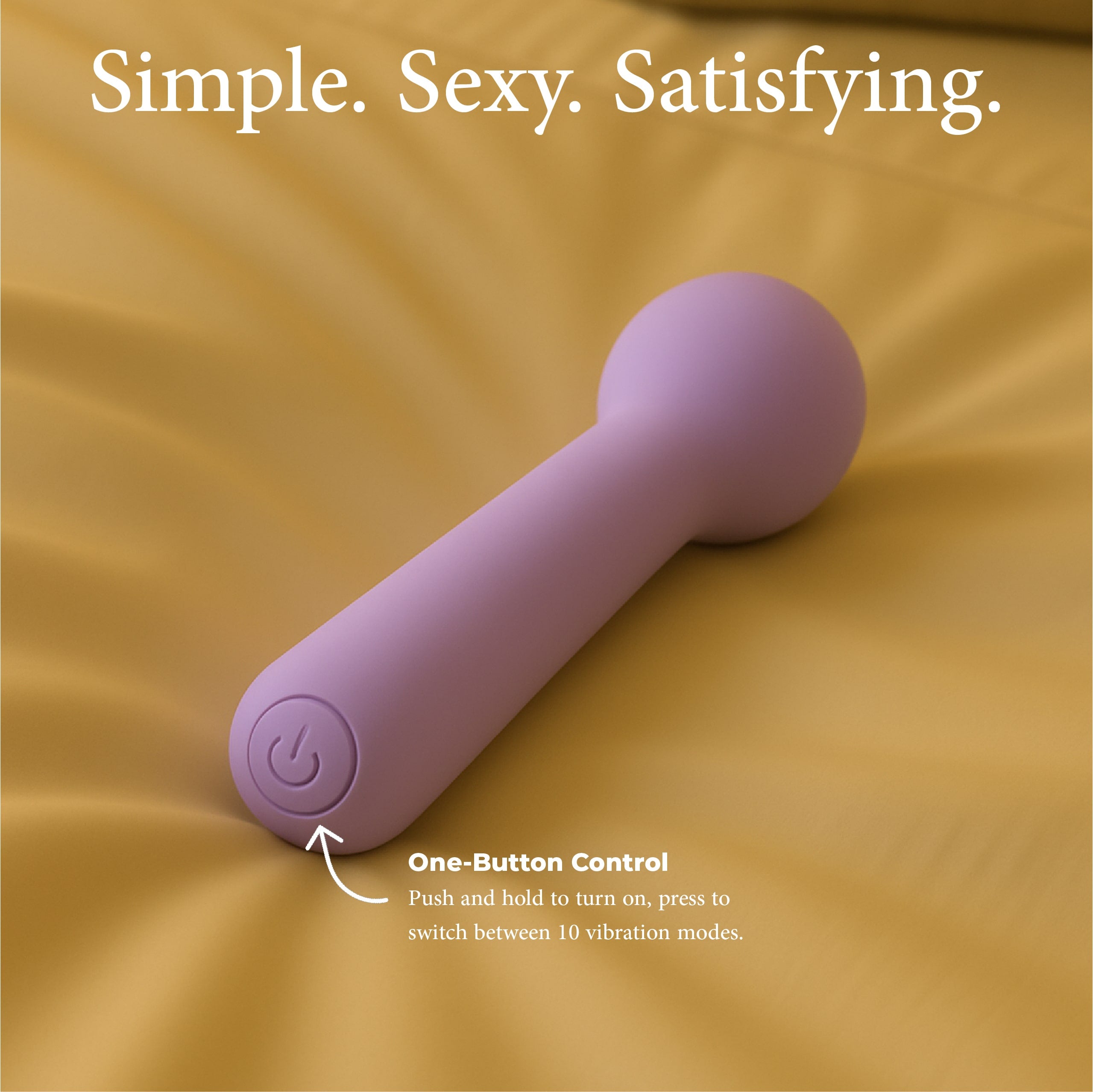 Joy Penny mini wand vibrator in purple showing single button control for vibration modes