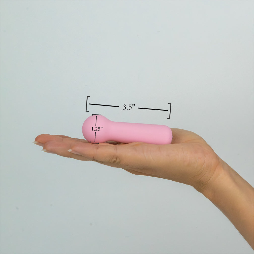 Joy Penny mini wand vibrator in pastel pink showing 3.5 inch length and 1.25 inch rounded head for external use