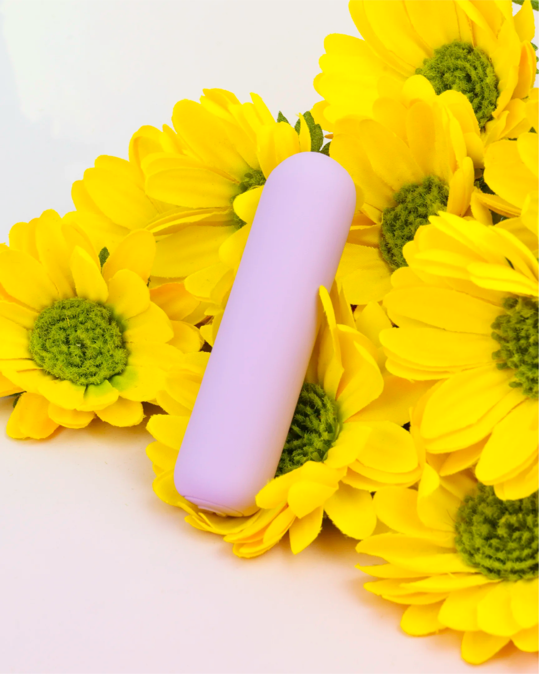 Pastel purple Joy Pippa rechargeable bullet vibrator styled with bright flowers, compact waterproof design made with body-safe silicone