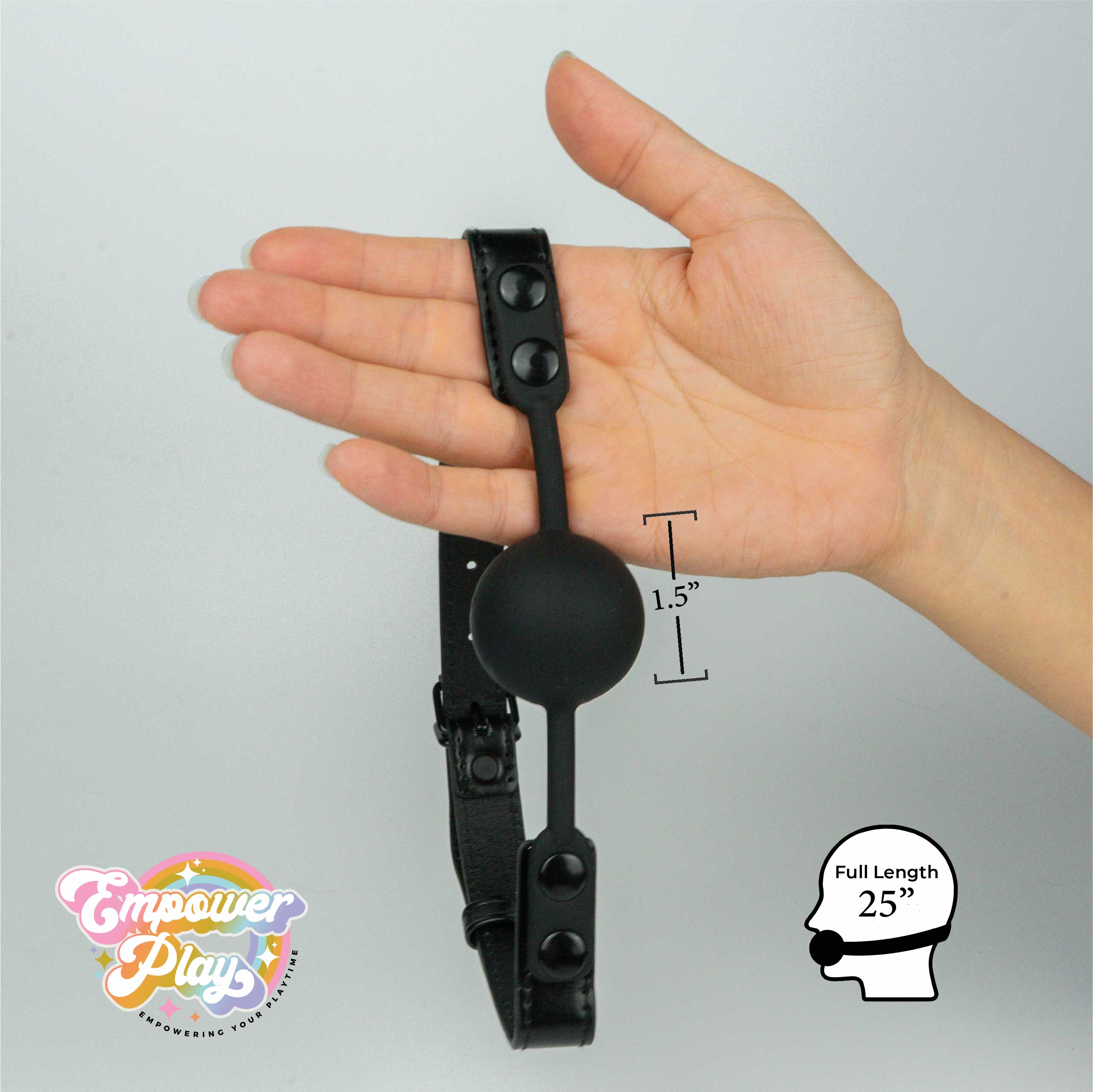 Midnight black silicone ball gag shown in hand with 1.5 inch ball size