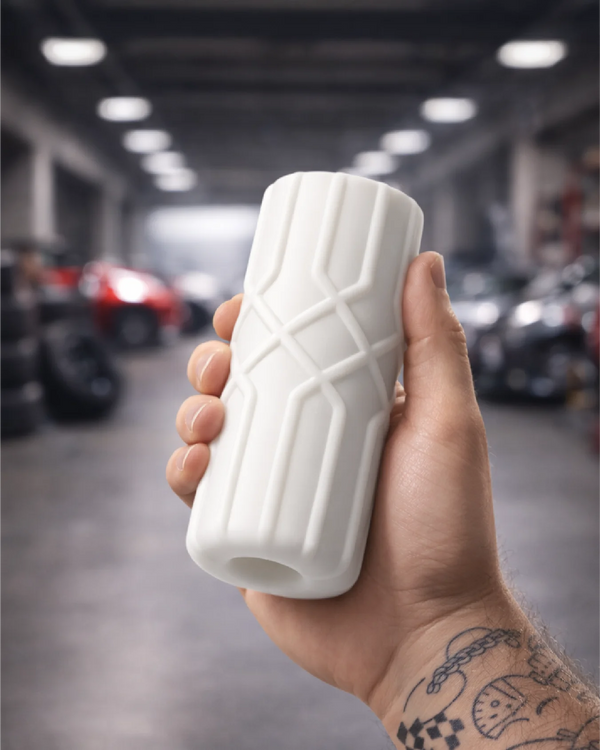 Powertrain male stroker held in hand showing size scale and precision grip design