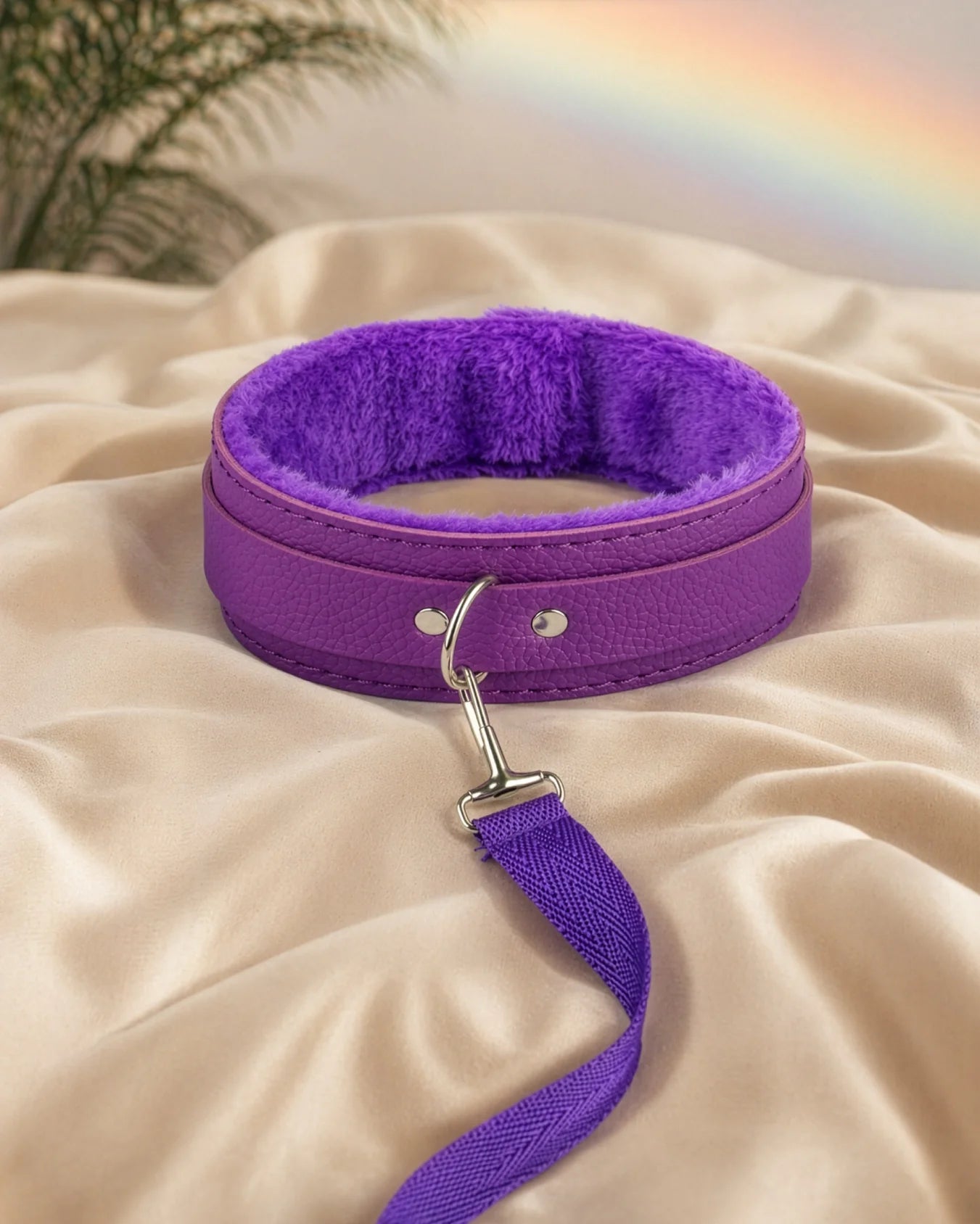 Purple bondage collar and leash placed on soft bedding, beginner-friendly collar designed for gentle control and comfort