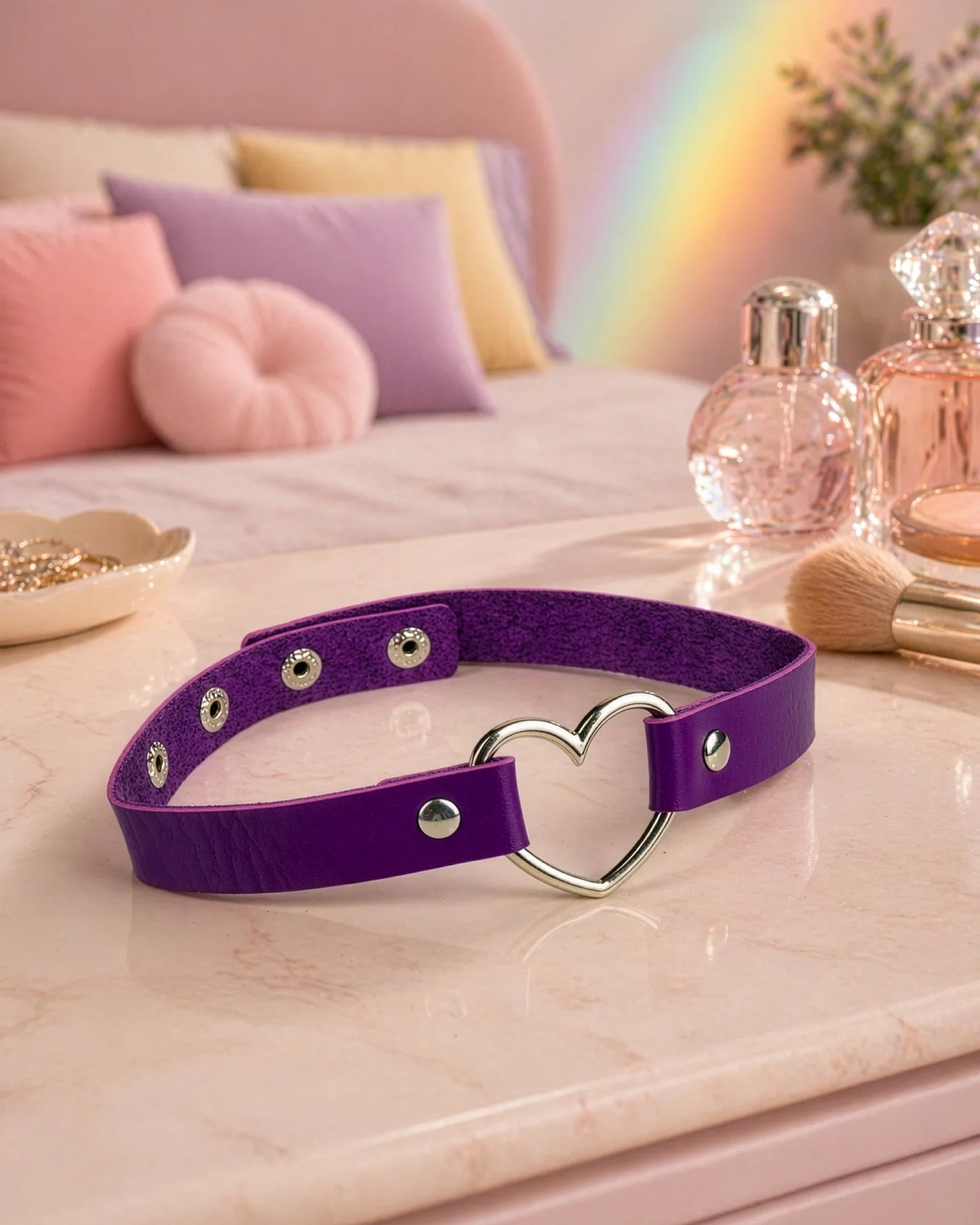 Purple heart choker collar displayed on vanity surface, faux leather BDSM collar with adjustable fit and metal hardware