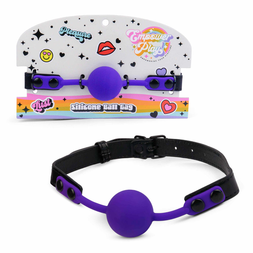 Royal purple silicone ball gag by Empower Play with retail packaging, beginner-friendly mouth gag