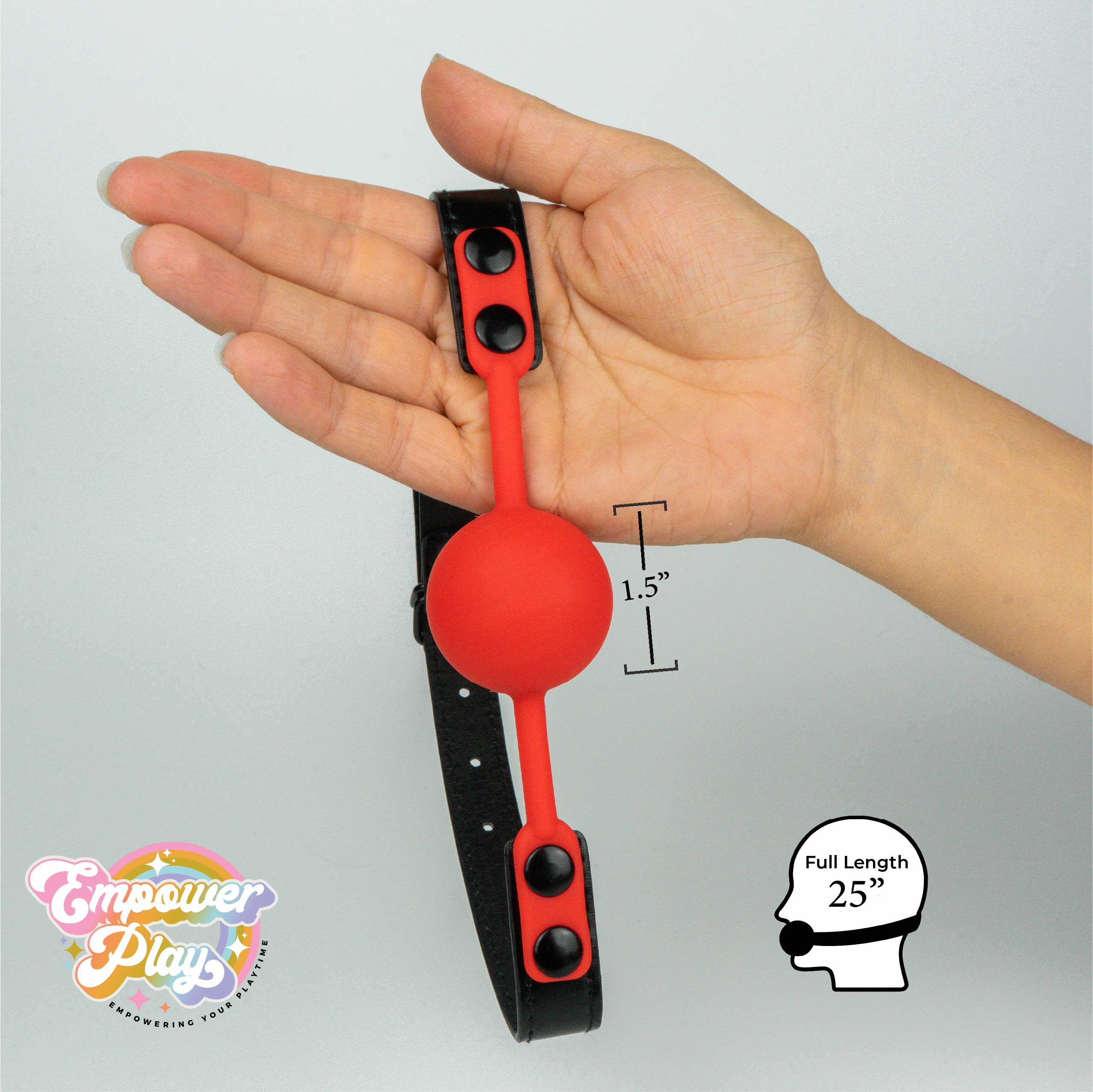 Scarlet red silicone ball gag shown in hand with 1.5 inch ball size