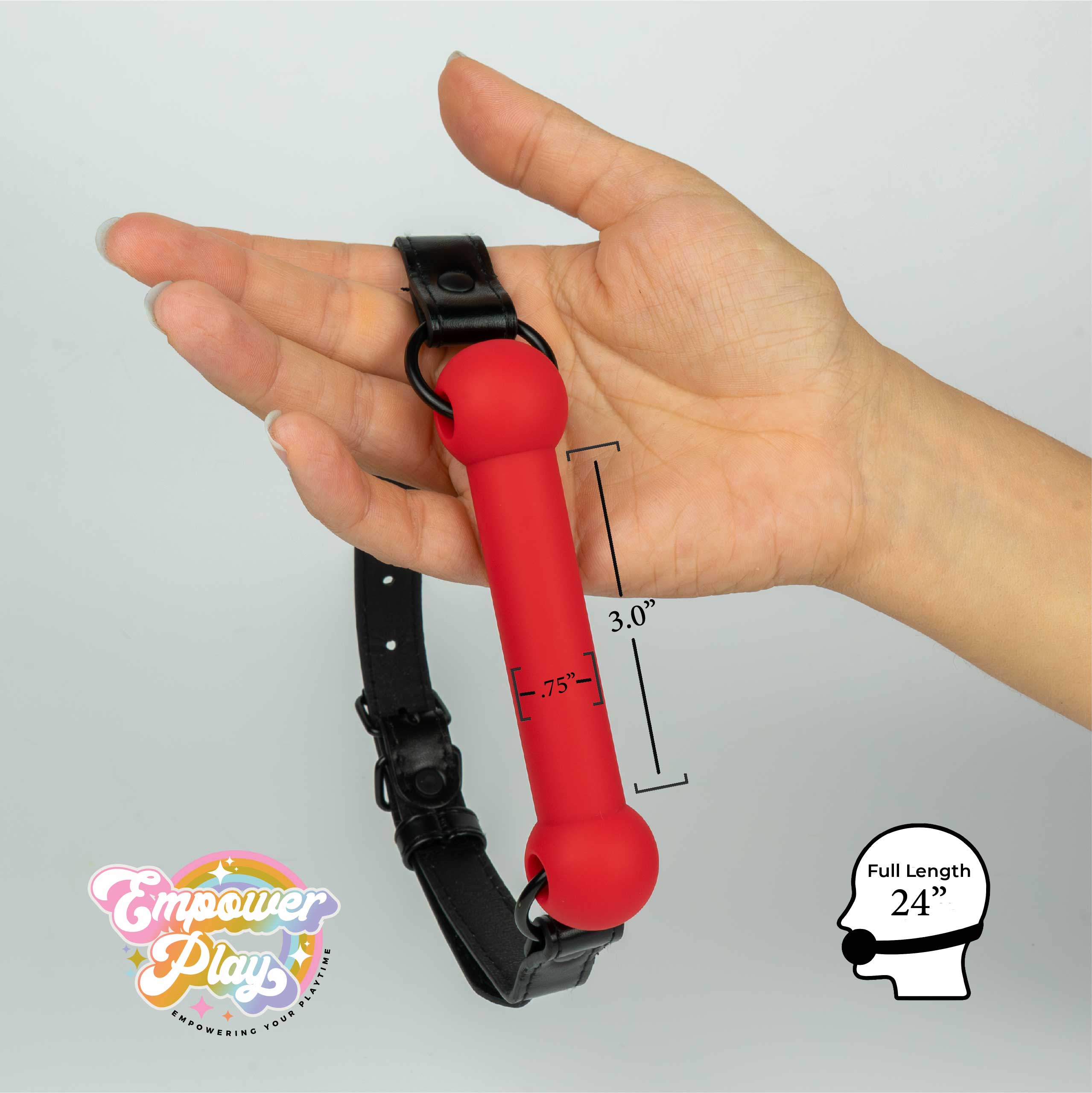 Scarlet red silicone bit gag shown in hand with size guide for light oral restraint
