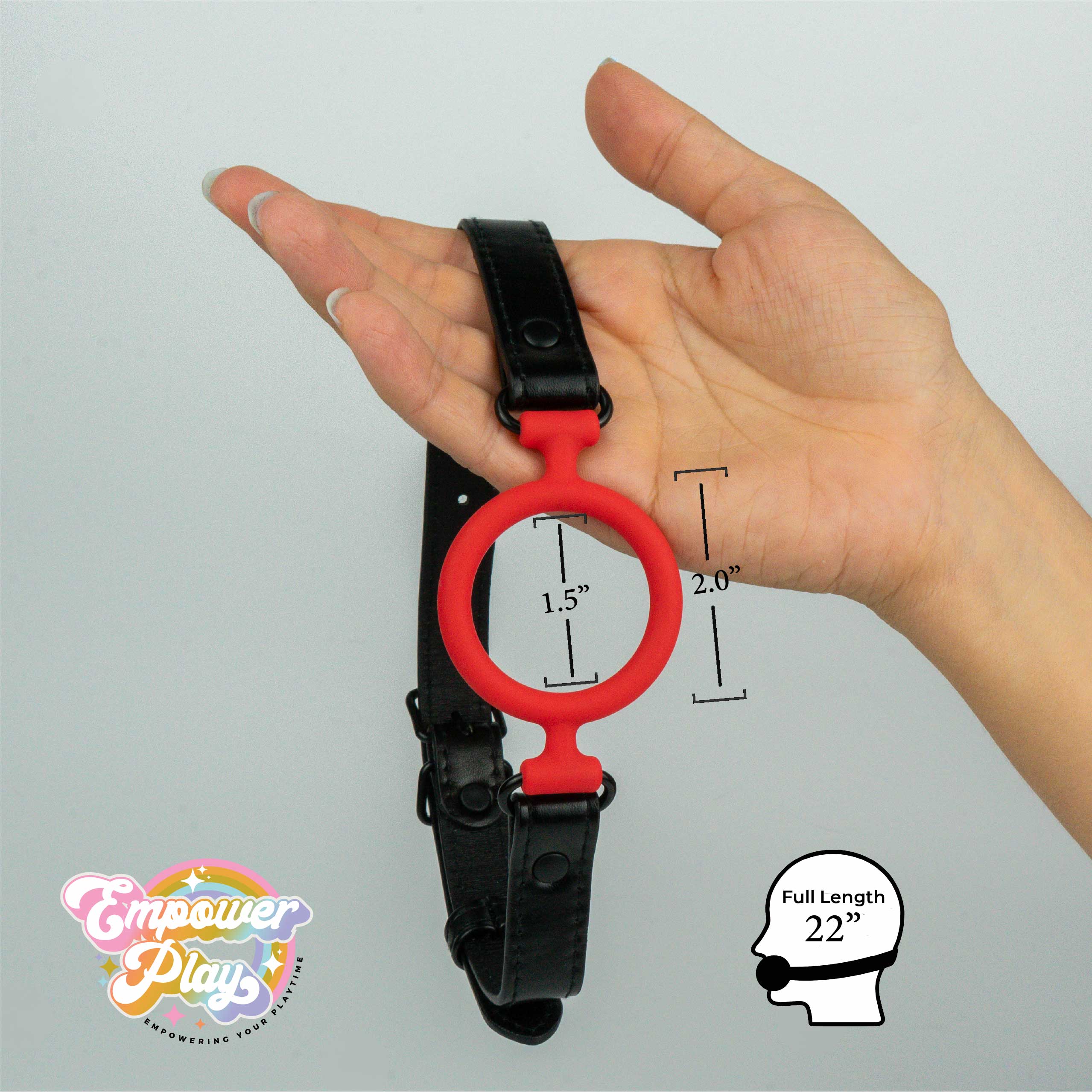 Scarlet red silicone O-ring gag shown in hand with size measurements for breathable open-mouth play